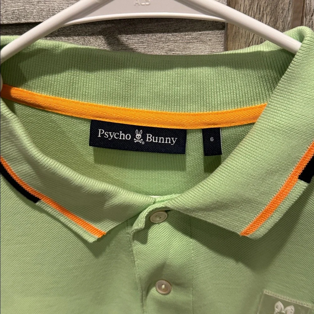 118. Psycho Bunny Light Green men’s Polo with Orange Accents, pre owned size. 6